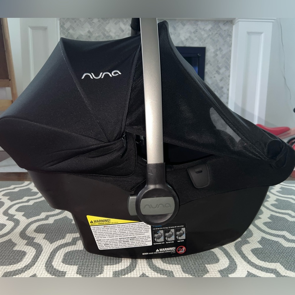 Nuna Pipa Lite LX w base, caviar. Gently used. Minor scratches on carrier handle